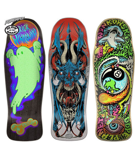 Three Winkowski skateboard decks with unique designs on a white background