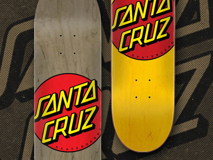 Two Santa Cruz skateboard decks shown side by side, each featuring a Classic Dot logo.