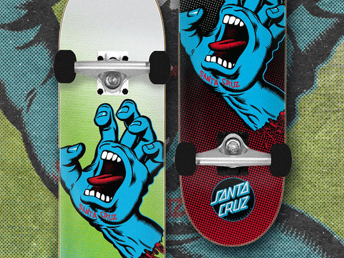 Santa Cruz Complete Skateboards - Two skateboard decks with Screaming Hand graphic designs on a textured background