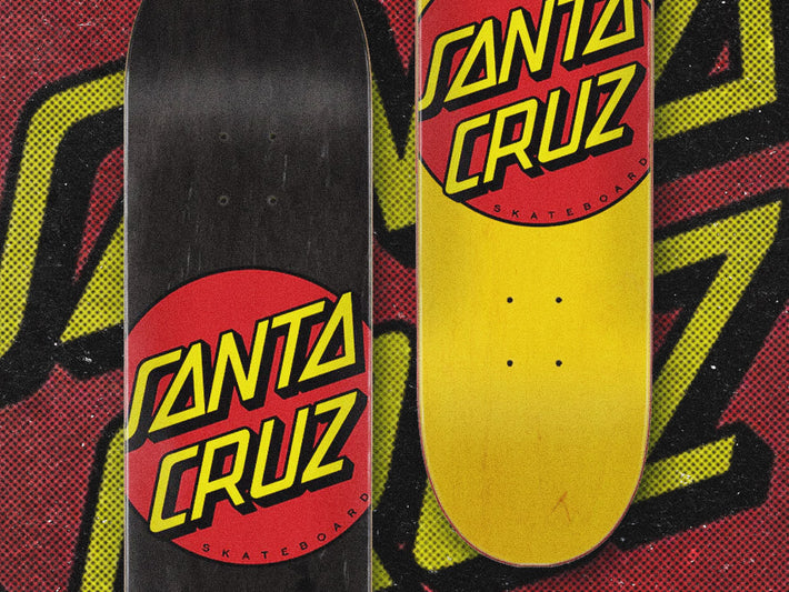Santa Cruz Skateboard Decks - Two Santa Cruz skateboard decks, one black and one yellow with Classic Dot graphic icons.