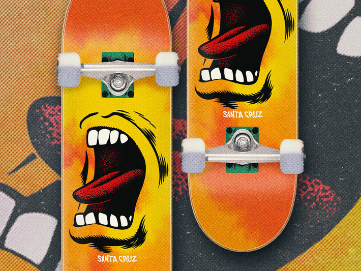 Two Santa Cruz skateboard completes with screaming face designs and Santa Cruz branding on a colorful background.